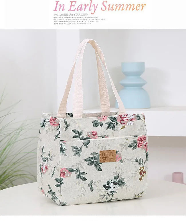 Women's large printed canvas tote bag with aluminium hardware in a horizontal square shape.