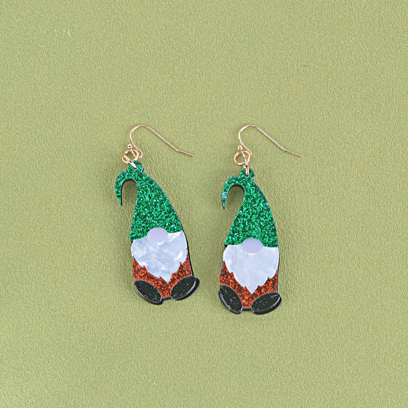 Santa Claus cartoon character acrylic fashion earrings on red, green, and mixed backgrounds.