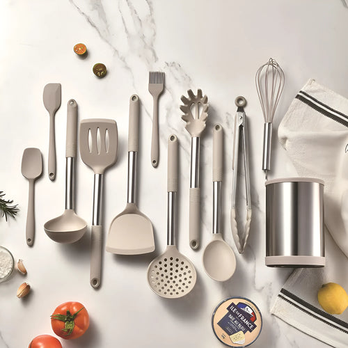 12-piece black silicone kitchen utensil set with tools stored in a rotating countertop storage bucket