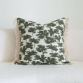 Green cotton and linen hotel pillow with decorative tassels and botanical patterns, shown with pillowcase and silk floss core.