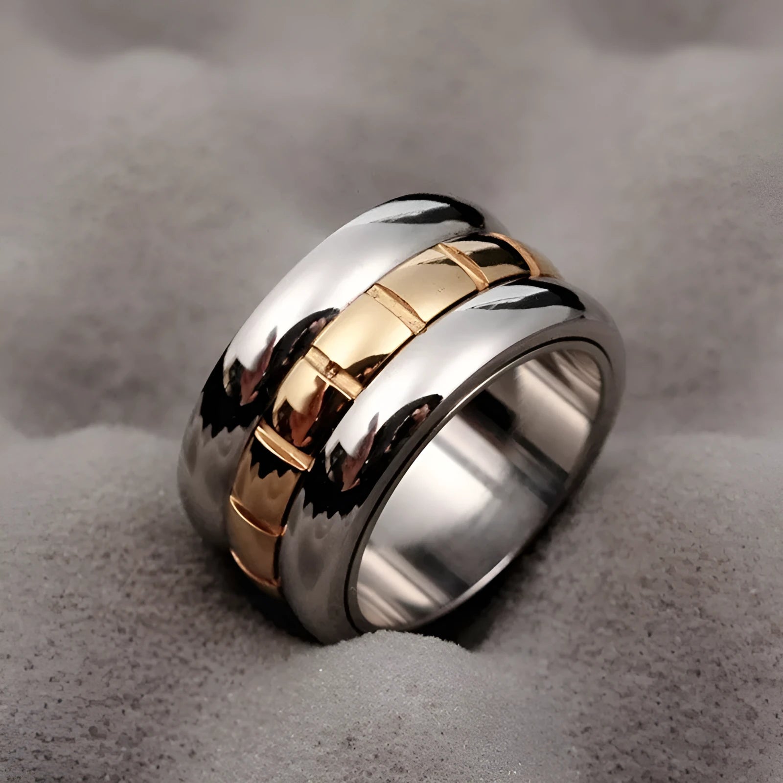 Gold titanium steel ultra-wide knuckle ring with a rotatable tail on a hand