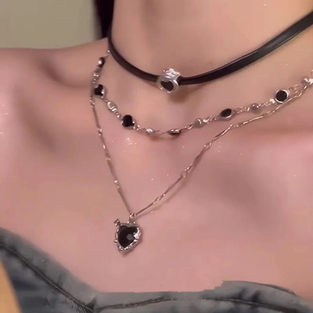 Women's adjustable multi-layer twin necklace with a leather loving heart pendant and crystal accents.