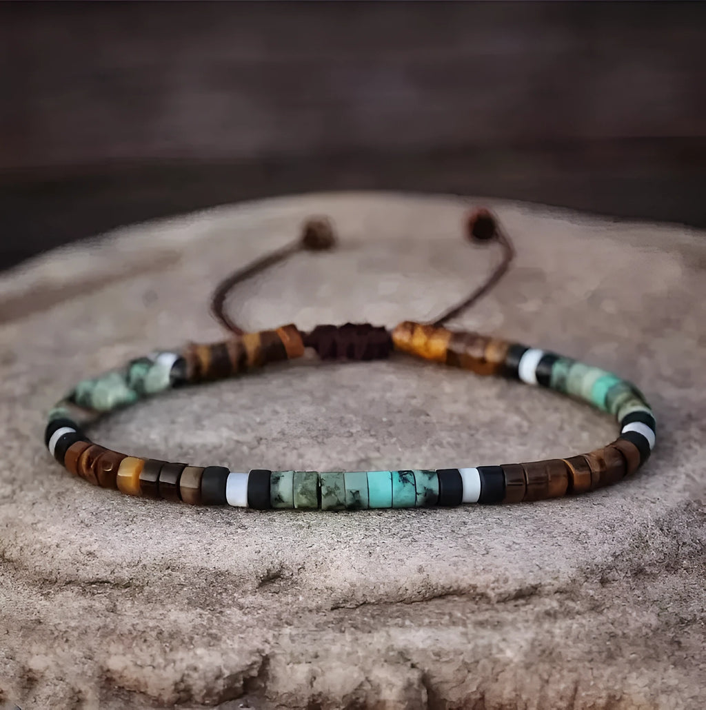 Women's hand-woven tigereye turquoise cylindrical flat bead bracelet with geometric texture and bamboo joint details