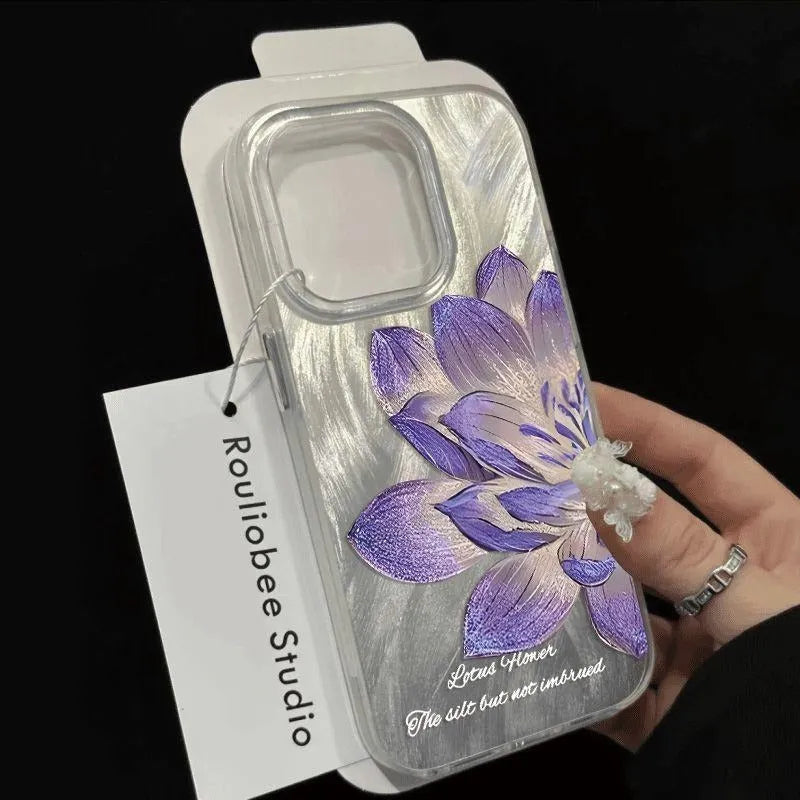 Hard polycarbonate iPhone case with blue lotus floral IMD pattern showing screen and camera cut-outs