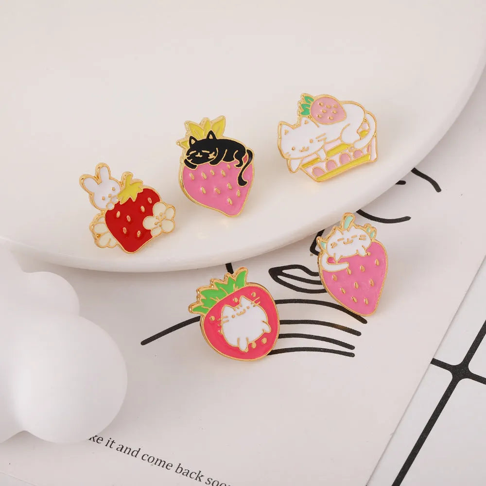 Alloy cake cat brooch with strawberry decoration and dripping oil effect in multiple colour options