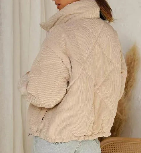 Apricot coloured women's corduroy jacket with a stand collar and full-length zipper.