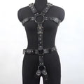 Black patent leather thin waist-cinching belt with a pin buckle on a mannequin.