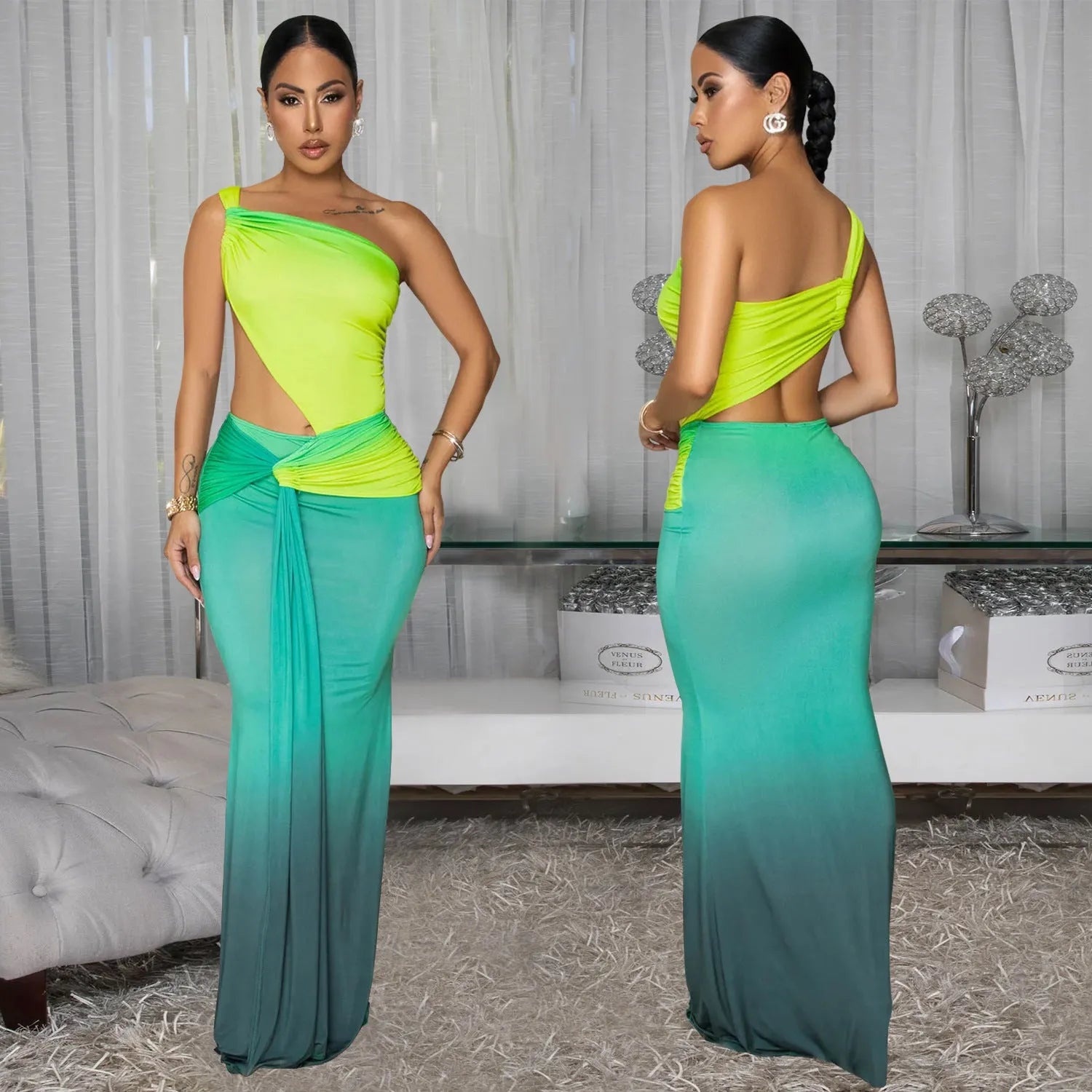 A woman wearing a long gradient colour dress with a cross-shoulder sleeveless design and high waist.