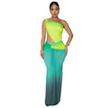 A woman wearing a long gradient colour dress with a cross-shoulder sleeveless design and high waist.