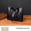 Soft PU horizontal square tote bag with double shoulder straps, black colour, sewing thread detail, and sandwich pocket