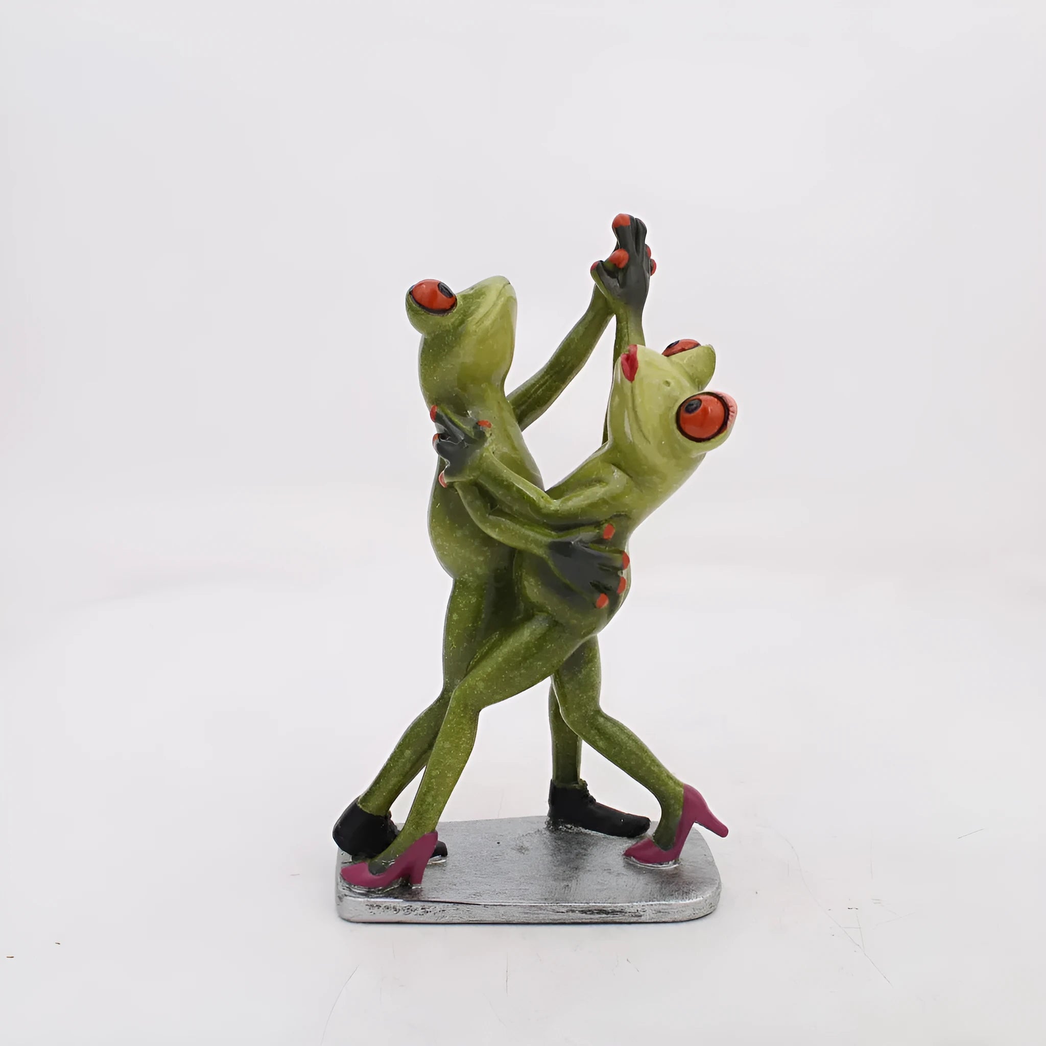 Pastoral style synthetic resin frog ornament with plastic base for shelf or desk decoration.