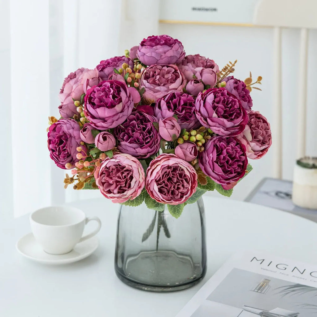 Artificial silk peony bouquet in a vase, showing realistic pink petals and green leaves for home decor.