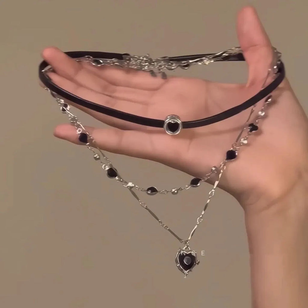 Women's adjustable multi-layer twin necklace with a leather loving heart pendant and crystal accents.