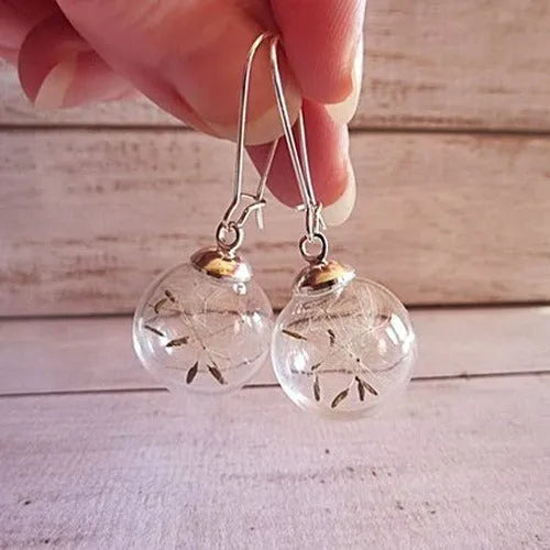 Clear glass ball earring with crystal dandelion seed inside on a silver French hook, 16mm size.