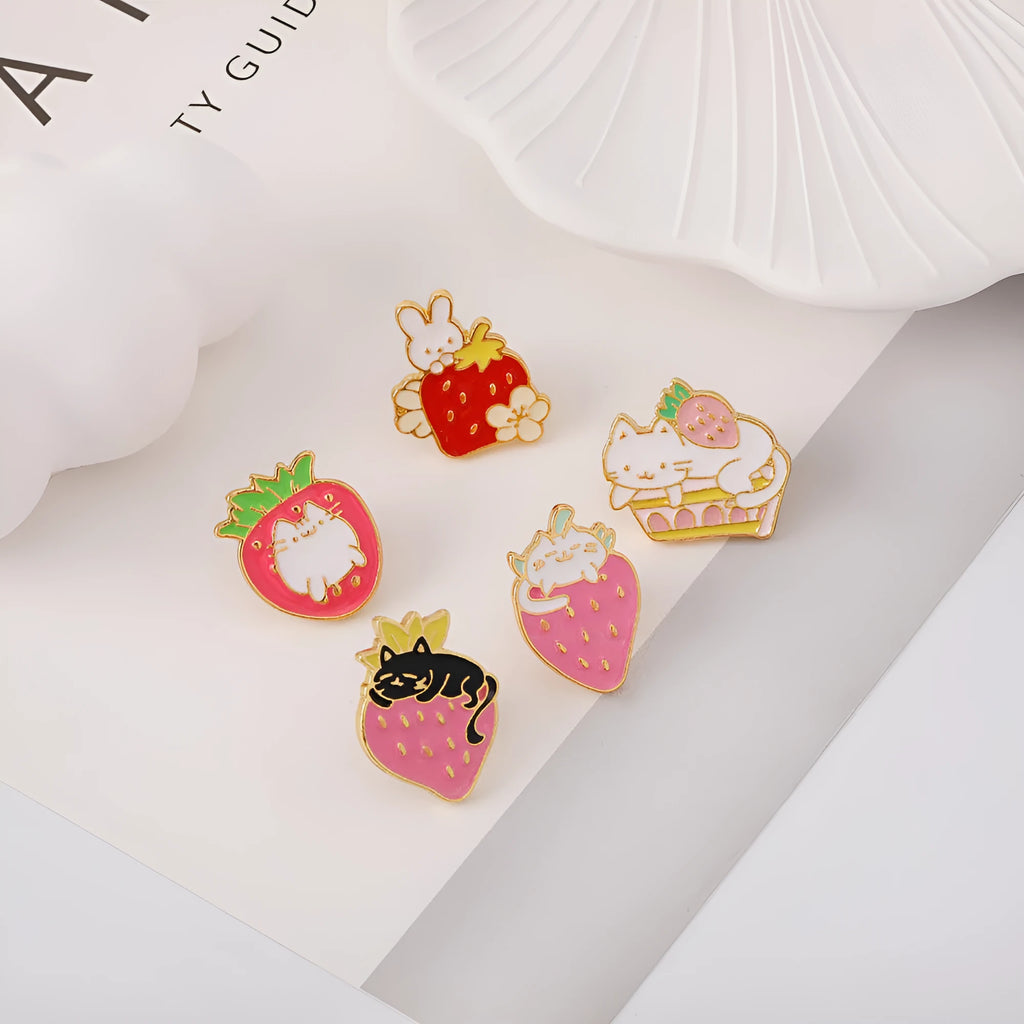 Alloy cake cat brooch with strawberry decoration and dripping oil effect in multiple colour options
