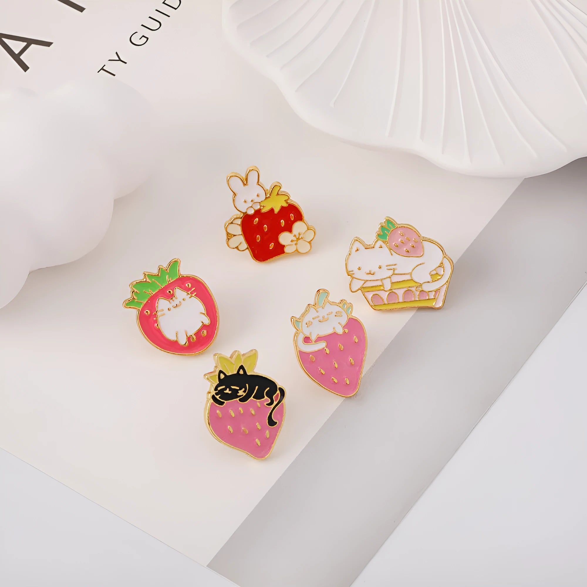 Alloy cake cat brooch with strawberry decoration and dripping oil effect in multiple colour options
