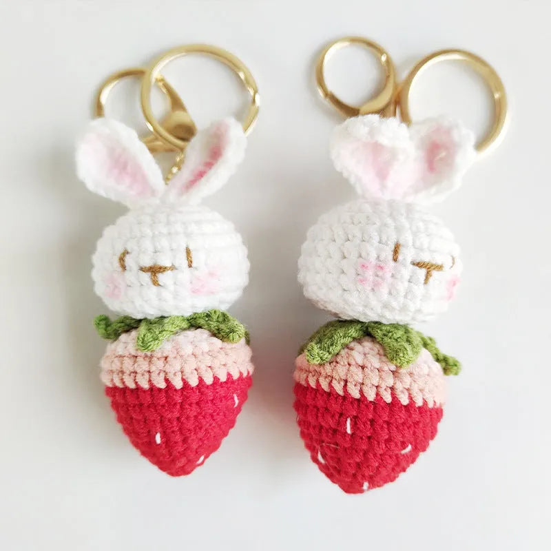 Hand-woven white rabbit strawberry pendant charm made from colourful doll wire on a keyring.