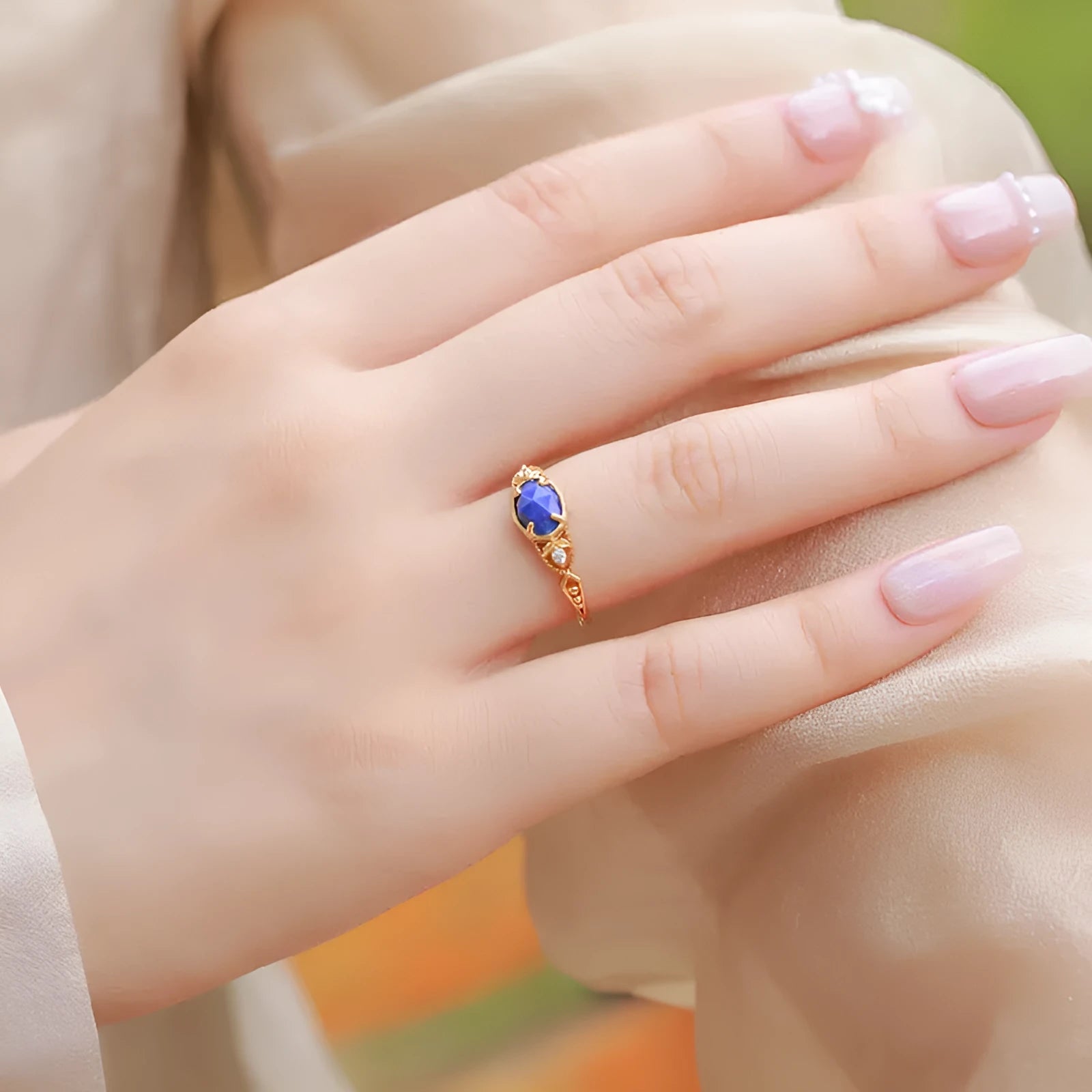 Silver geometric ring with oval lapis lazuli stone showing blue forest night sky pattern
