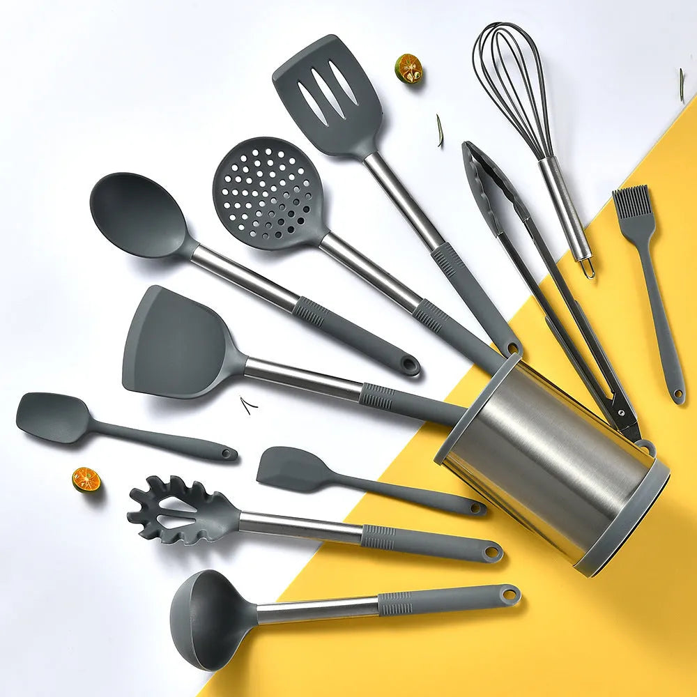 12-piece black silicone kitchen utensil set with tools stored in a rotating countertop storage bucket