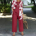 Women's blue three-piece casual suit set with printed coat, matching vest, and trousers on a hanger.