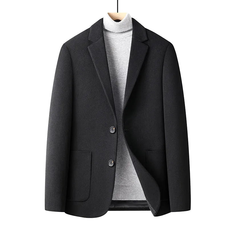 Men's slim fit wool suit jacket in grey on a hanger.