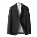 Men's slim fit wool suit jacket in grey on a hanger.