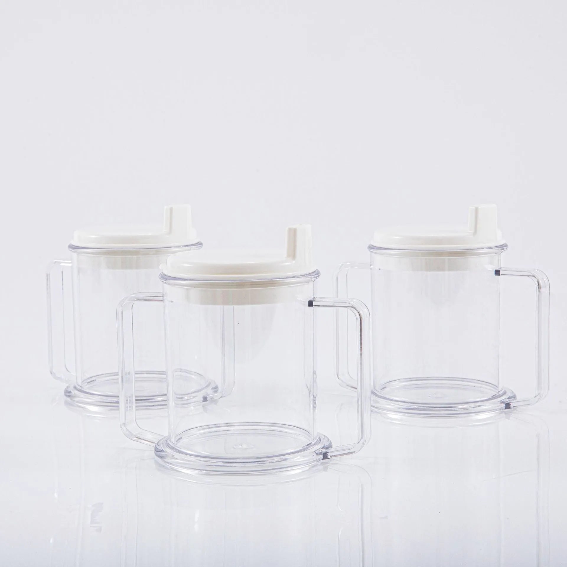 Transparent plastic drinking cup with a simple, modern design on a plain background.