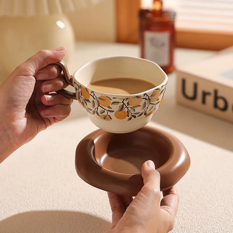 Black and orange antique style ceramic coffee cup and saucer set with 210ml capacity.