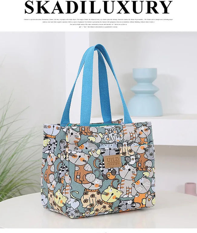 Women's large printed canvas tote bag with aluminium hardware in a horizontal square shape.