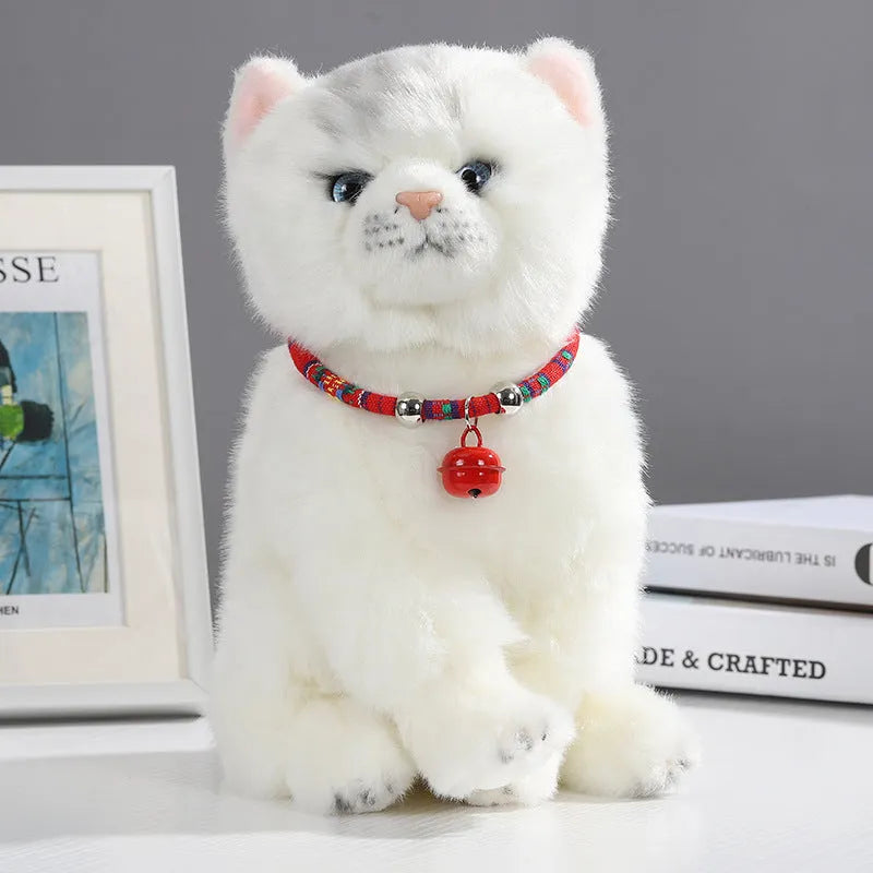 Coloured ethnic style pet collar with a metal bell on a cat or small dog