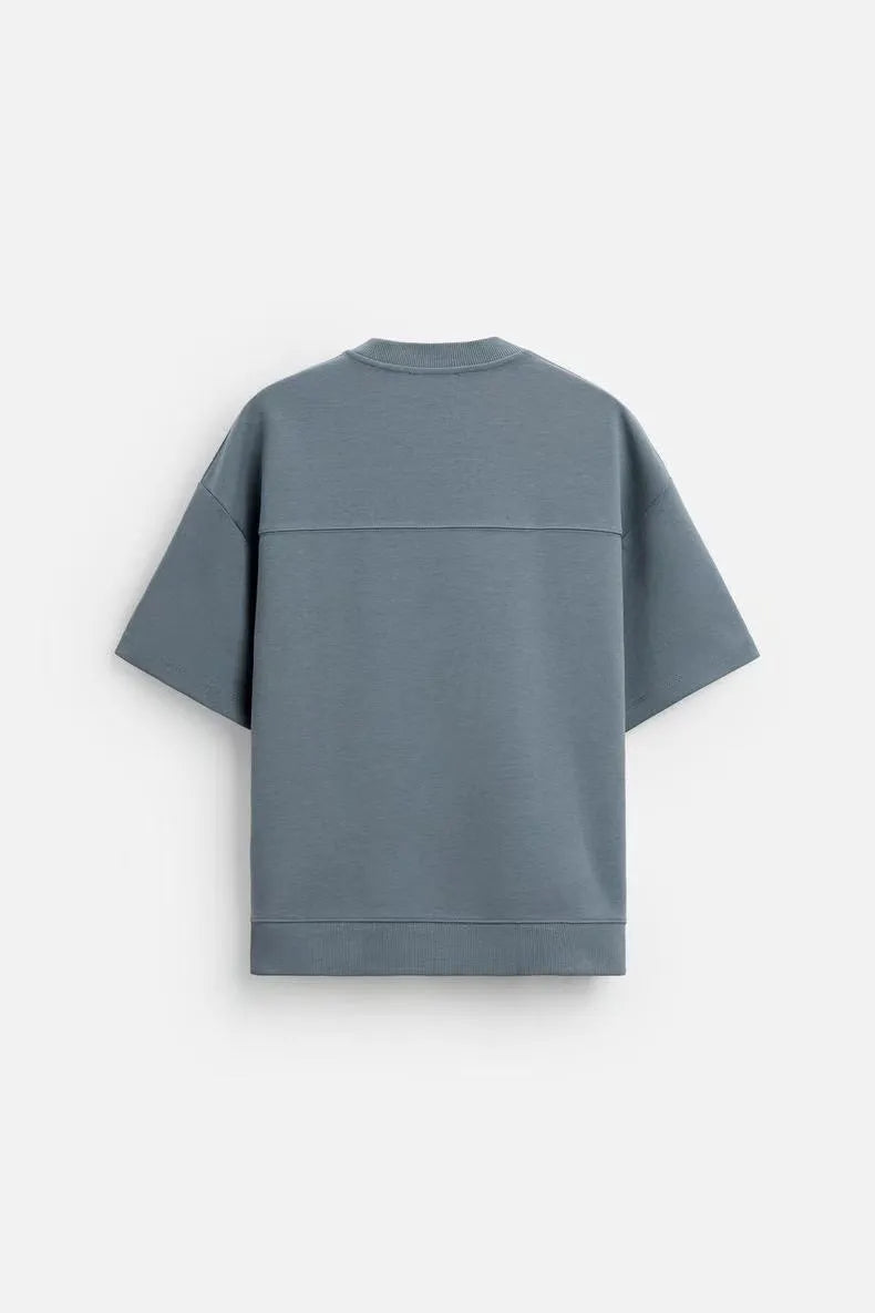 Loose double-sided texture polyester short sleeve top and matching shorts set on a hanger