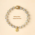 Hand-woven crystal bracelet with gray moonstone, sunstone, and strawberry quartz beads in pastoral style.
