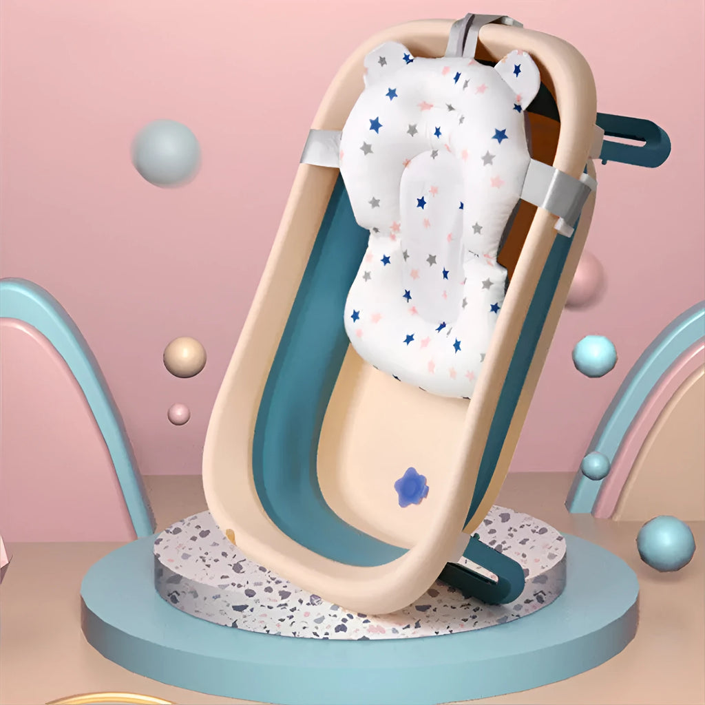 Foldable baby bath support mat with styrofoam cushion in white star pattern, placed in a bathtub