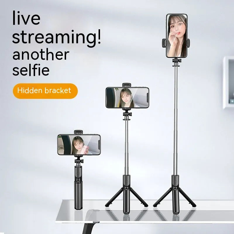 Black selfie stick tripod with wireless Bluetooth remote, universal phone holder, and optional ribbon fill light