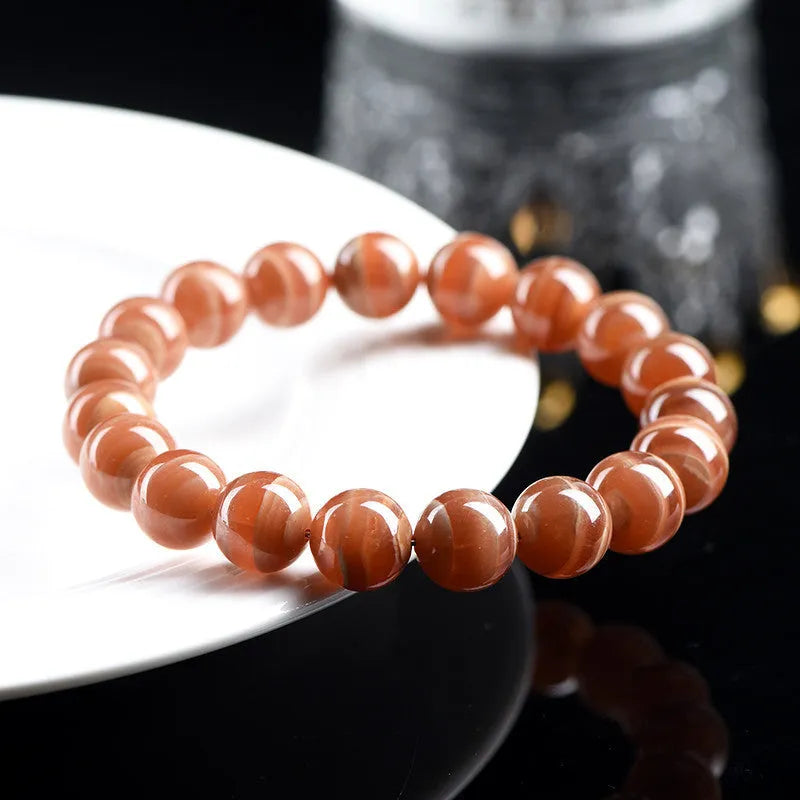 Natural Peruvian rhodochrosite bead bracelet in old mine colour, showing round 8mm beads.