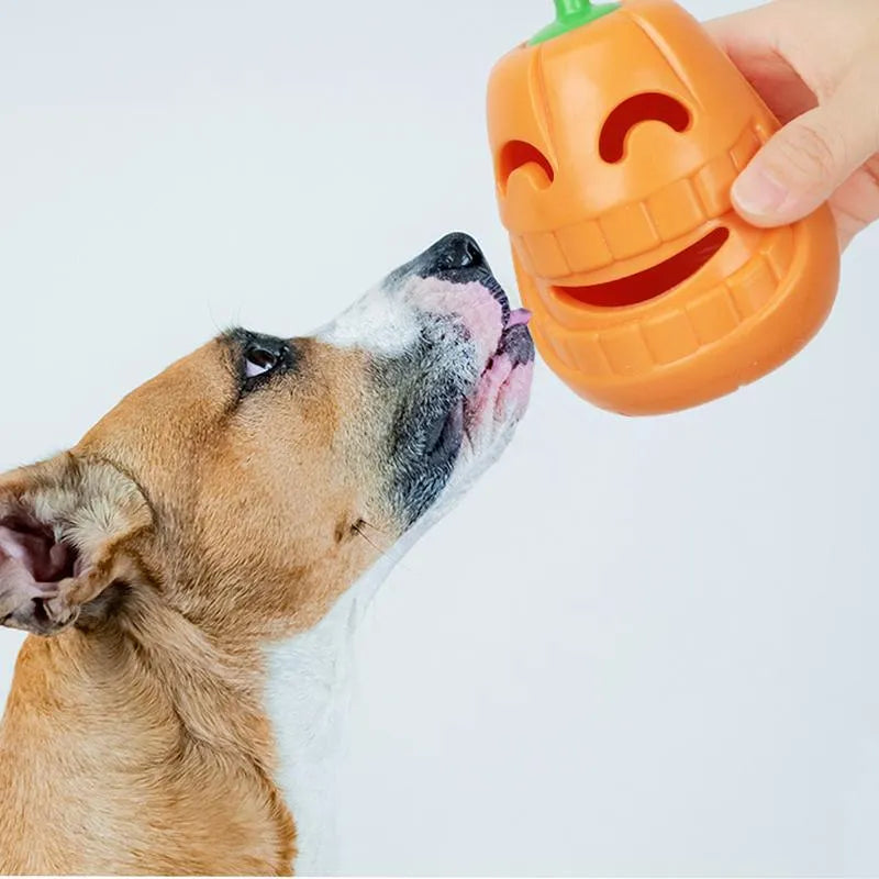 Yellow pumpkin-shaped TPR dog chew toy for aggressive chewers, showing textured ridges.