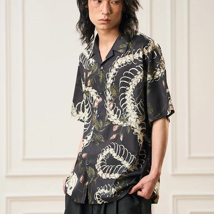 Original designer snake bone pattern printed on a short sleeve Cuban collar shirt in loose fit.