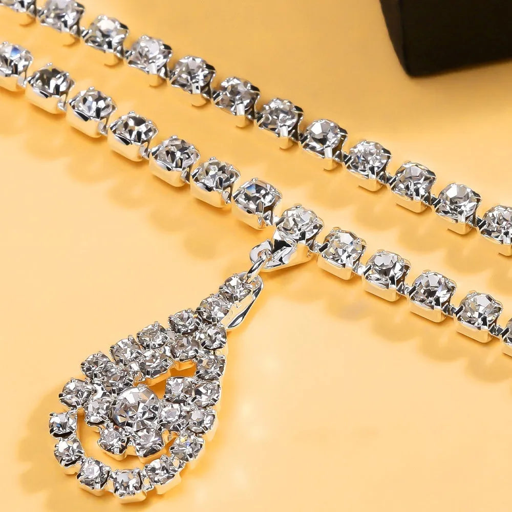 Gold or silver women's waist chain with rhinestone drop pendant and tassel, 105cm long.