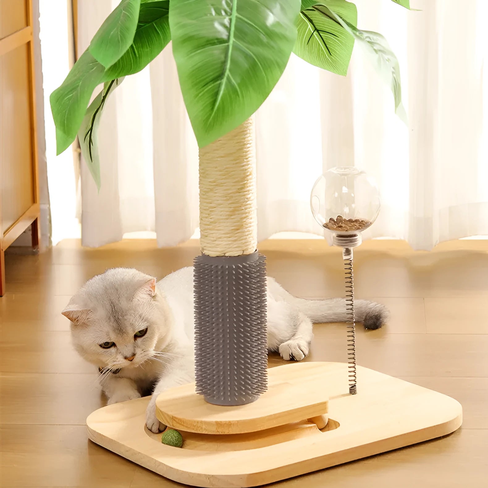 Natural wood vertical cat scratching post with sisal rope and a dangling ball toy on a beige carpet