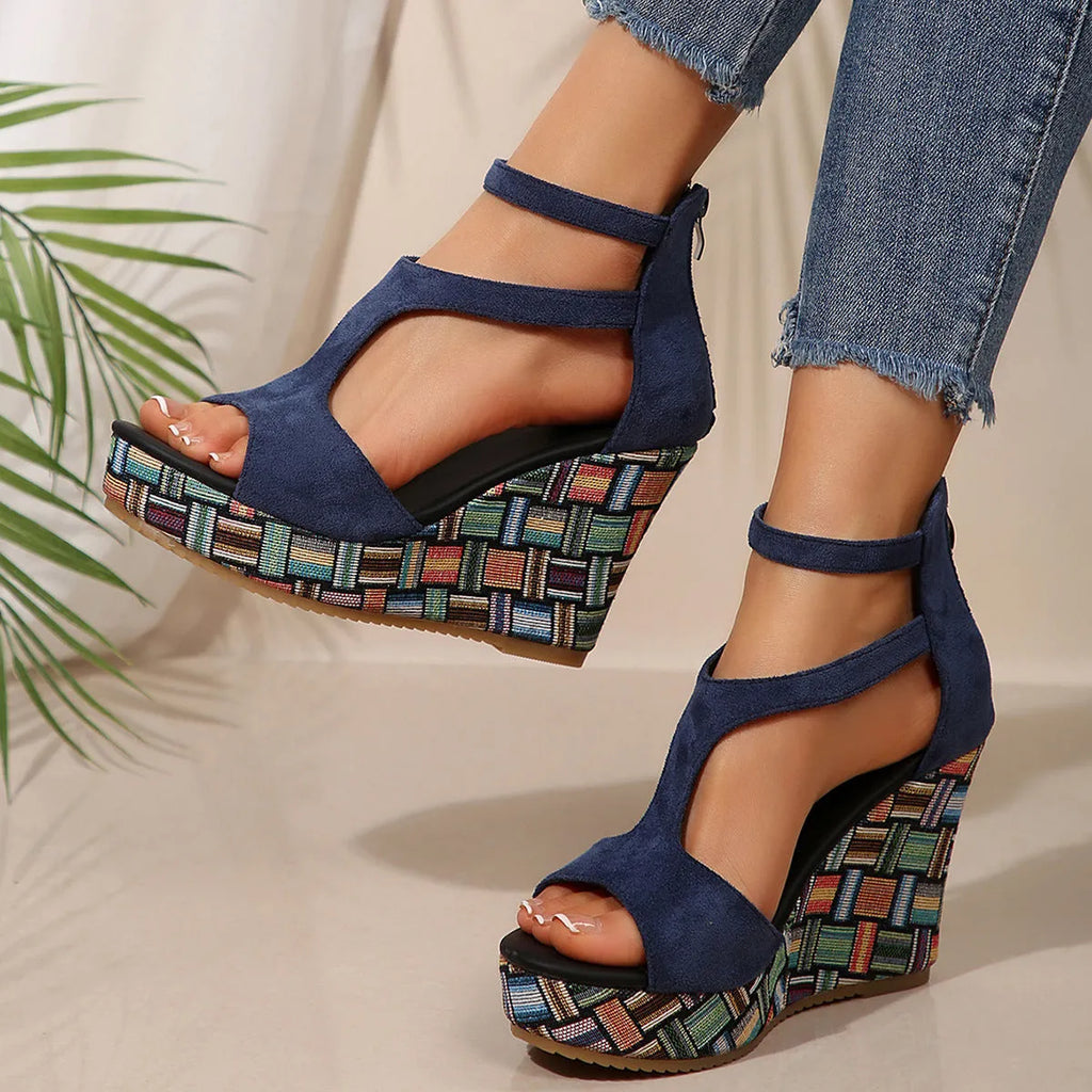 Women's cream white ankle-strap sandals with thick rubber sole, buckle closure, and cloth upper.