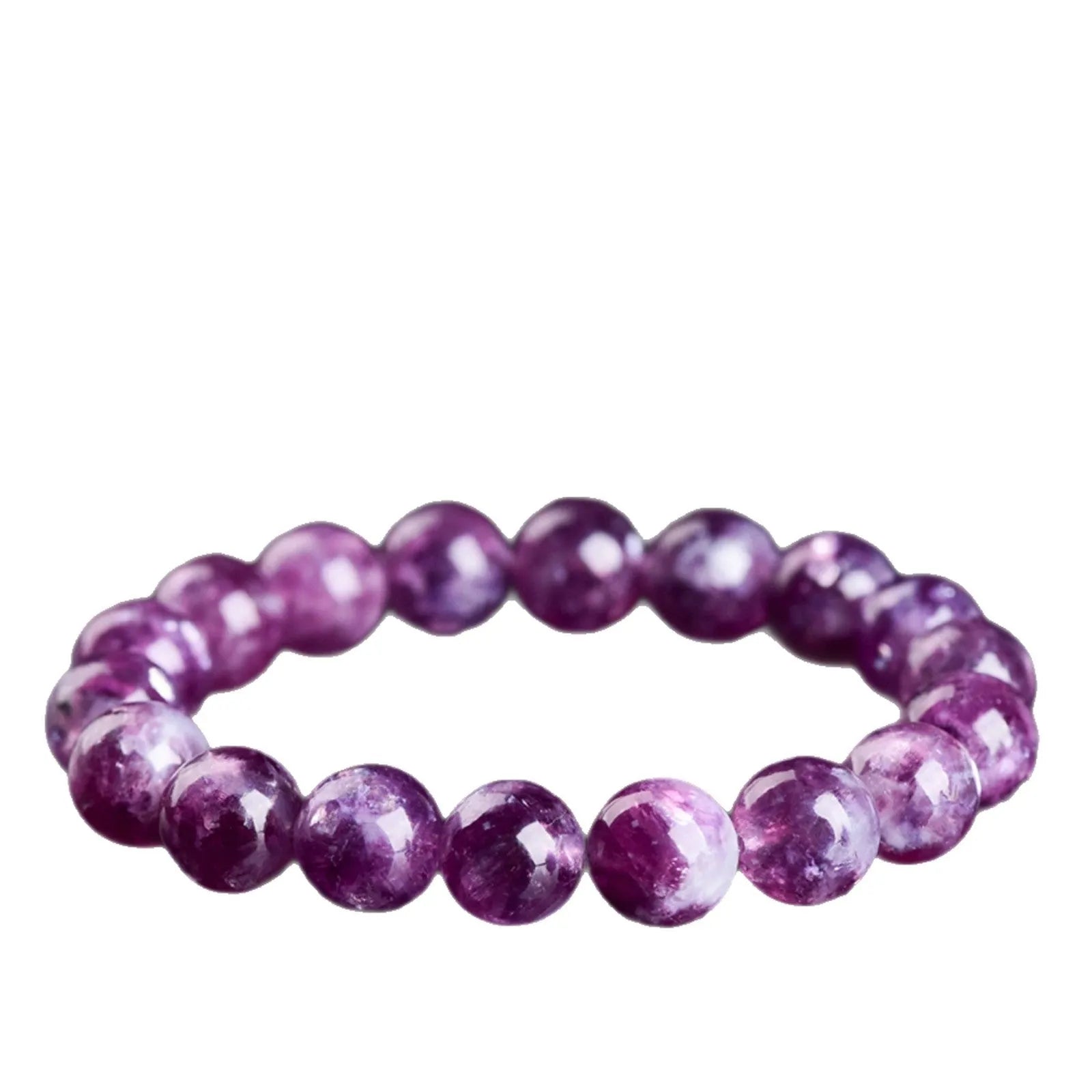 Geometric purple and pink polished crystal bracelet on a wrist, showing single strand of beads.