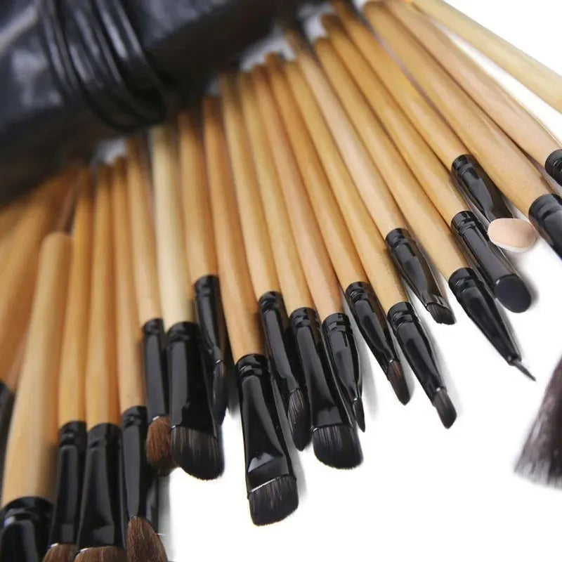 24 professional makeup brushes with wooden handles in a black PU gift bag