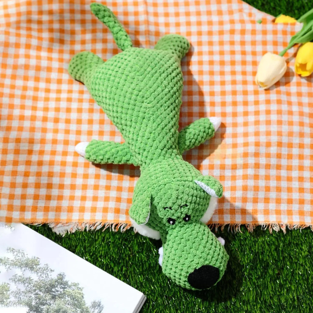 Green corn cob shaped plush dog toy for grinding teeth with textured kernel design.