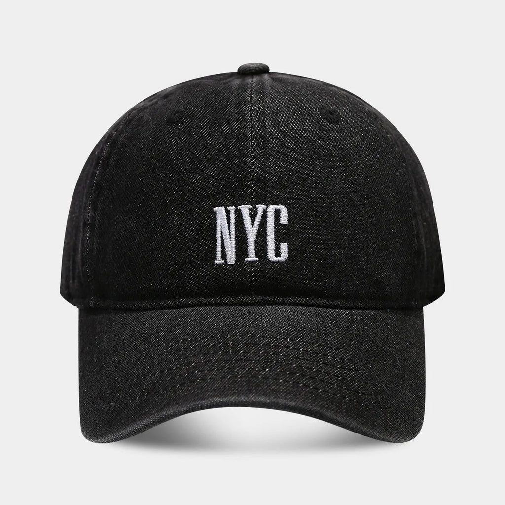 Adjustable denim peaked cap with embroidered lettering in light blue, dark blue, or black