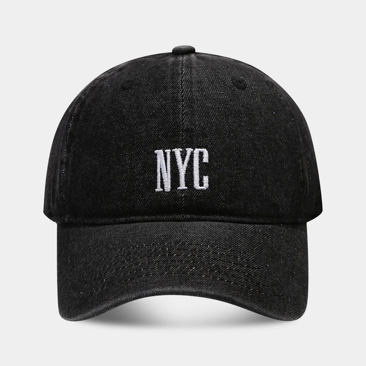 Adjustable denim peaked cap with embroidered lettering in light blue, dark blue, or black