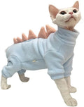 Sphynx cat wearing a green dinosaur fleece costume with a tail and back spikes.