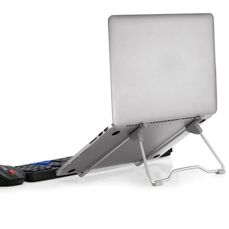 Grey aluminium mobile phone and laptop stand with adjustable tilt angle on a desk