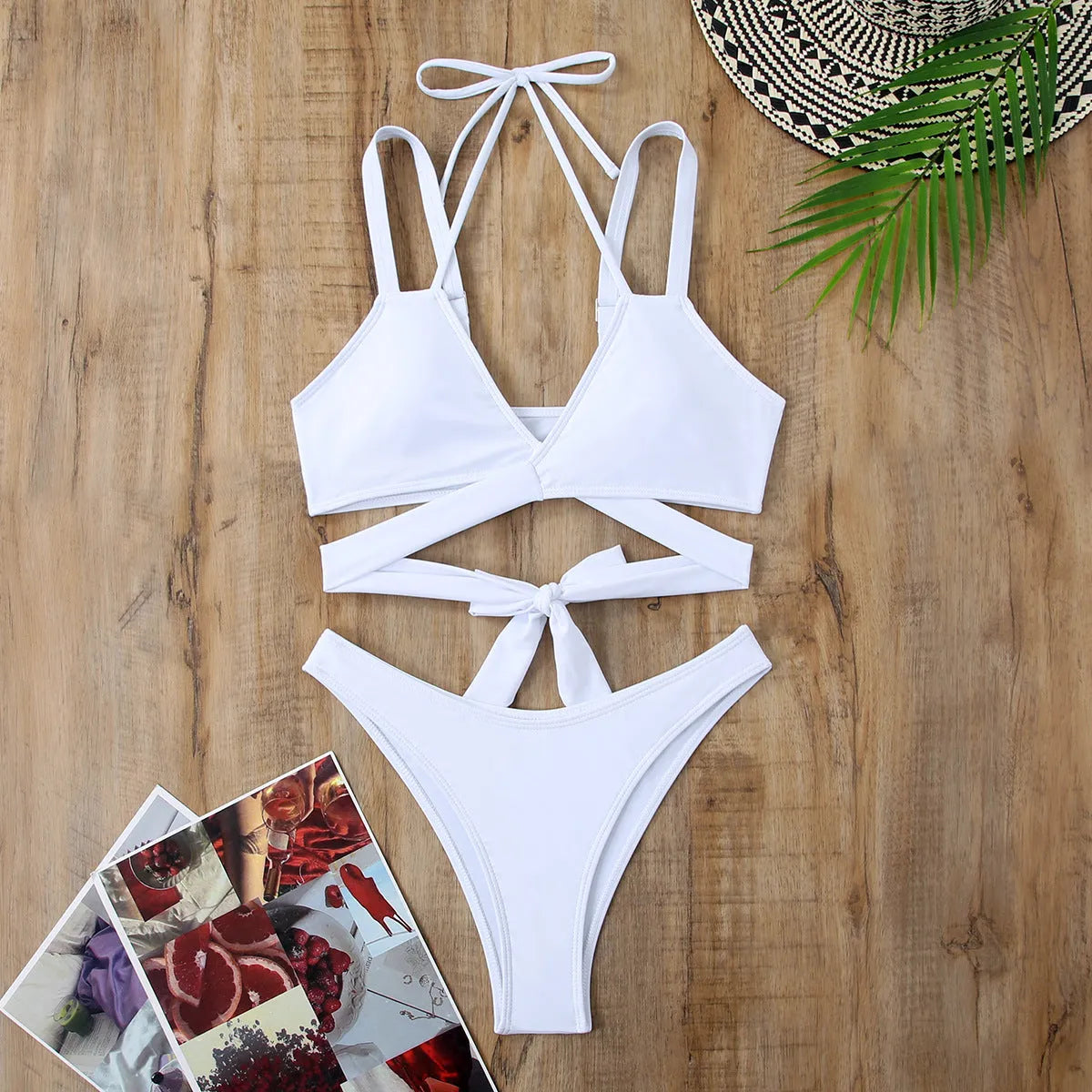 Solid colour strap bikini swimsuit for women on a mannequin, showing the brief cut and sleeveless design.