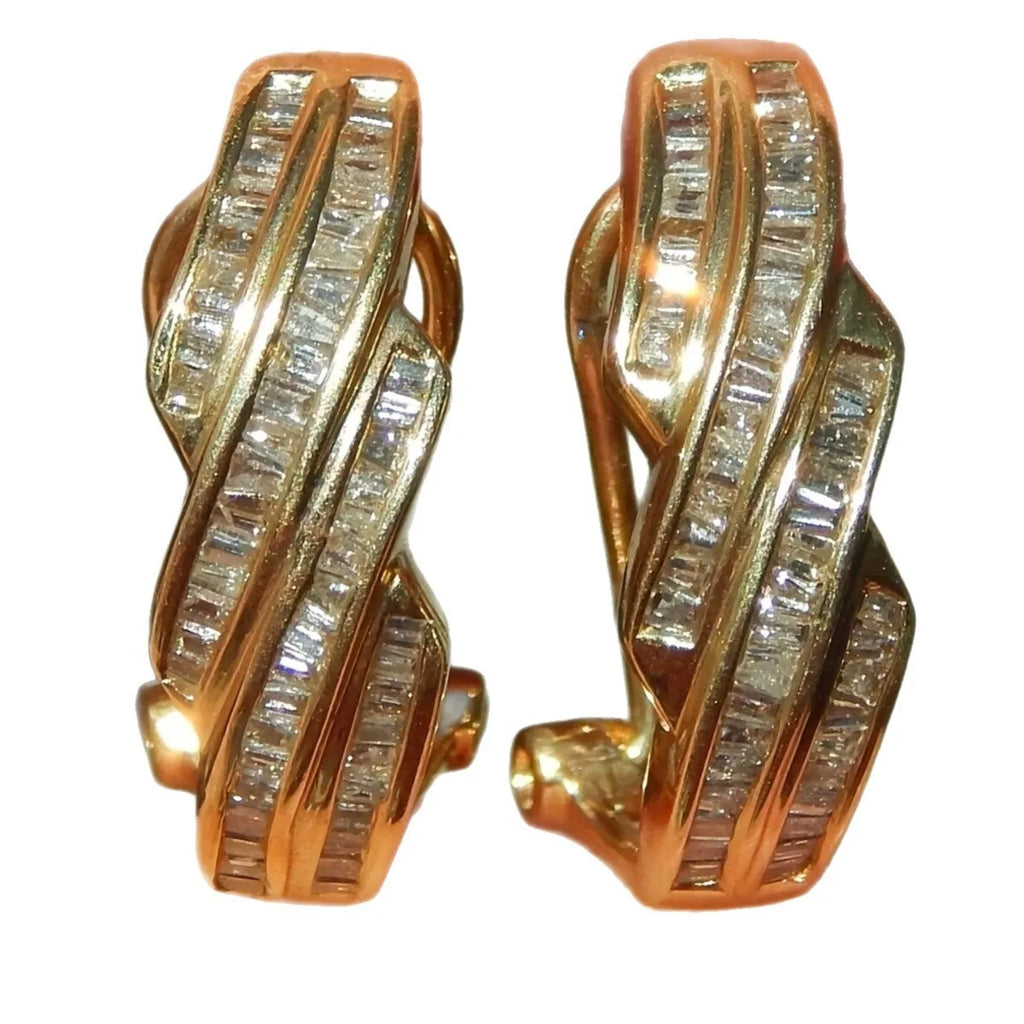A pair of gold geometric earrings with a round copper design.