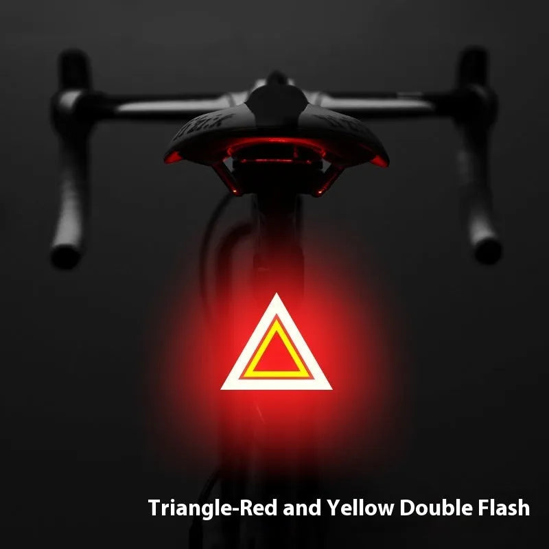 USB rechargeable bicycle taillight with flowing red light pattern, mounted on a bike
